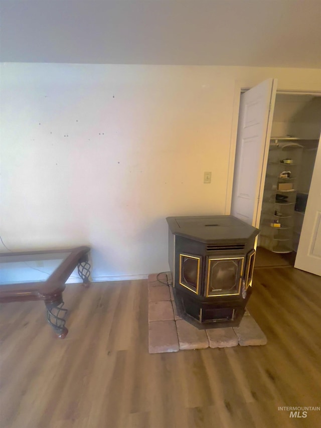 58438 Mansford Ave, Murphy Hot Springs, ID 83302 - room details featuring a wood stove and wood finished floors