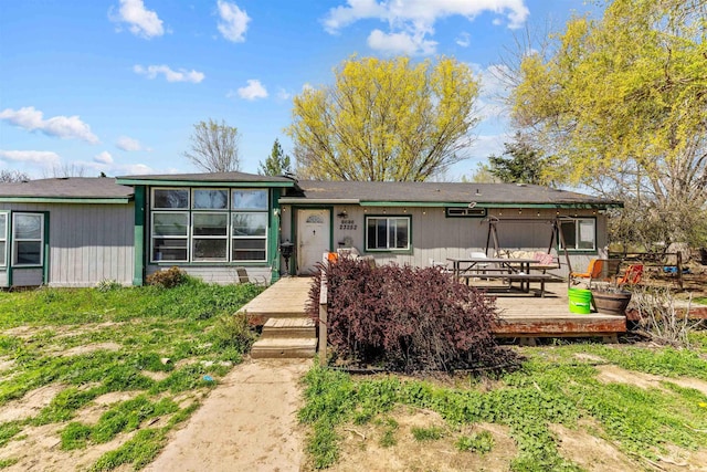 view of front of house featuring a wooden deck