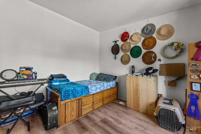 bedroom with light hardwood / wood-style flooring