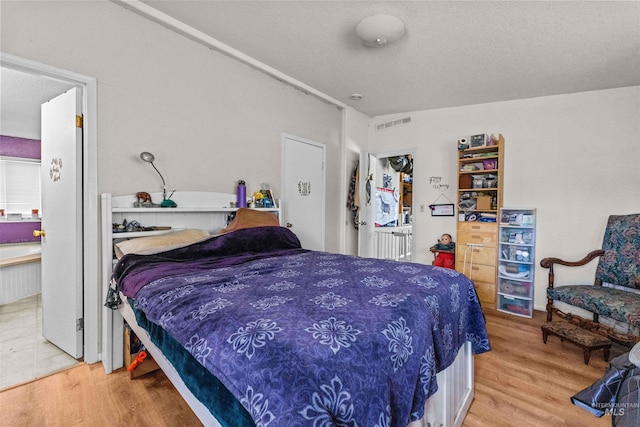 bedroom featuring light wood-type flooring