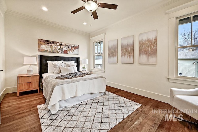 bedroom featuring crown molding, baseboards, recessed lighting, wood finished floors, and a ceiling fan