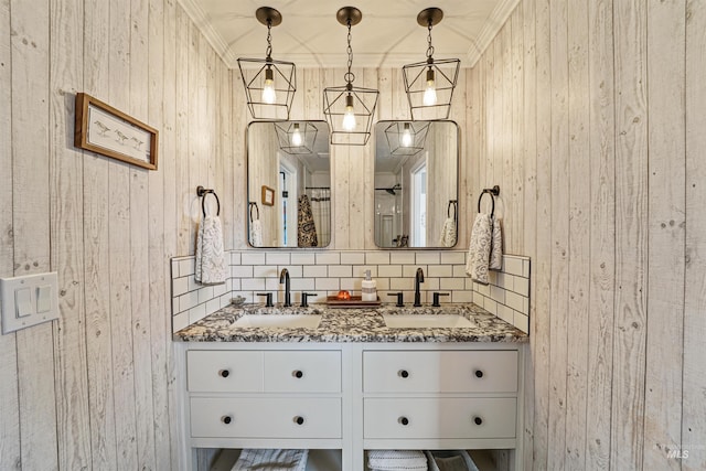 bathroom with double vanity, decorative backsplash, and a sink