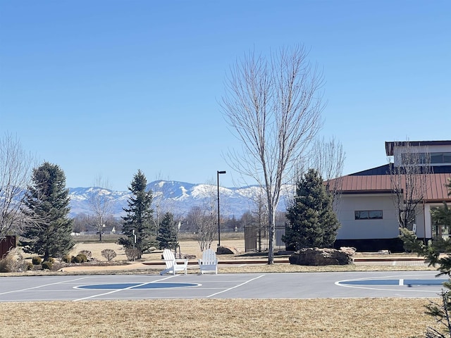 view of sport court with community basketball court and a mountain view