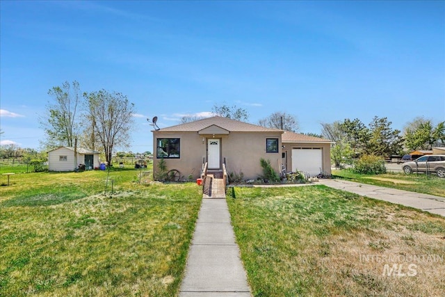 805 Utah, Gooding, ID 83330 - view of front of house with a garage, stucco siding, a front lawn, and concrete driveway
