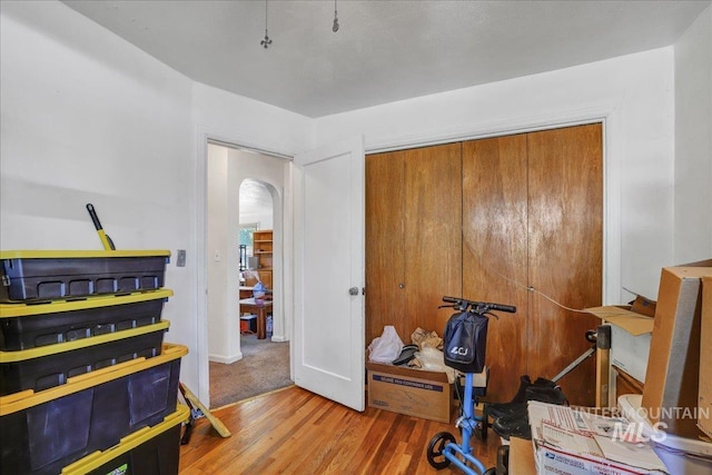 805 Utah, Gooding, ID 83330 - workout room featuring arched walkways, wood finished floors, and baseboards