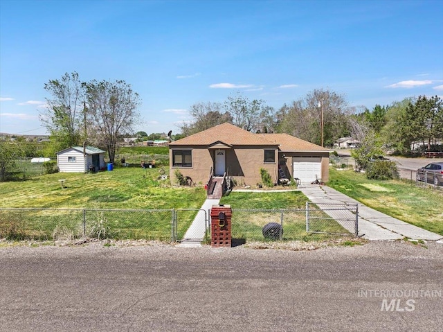 805 Utah, Gooding, ID 83330 - view of front of home with a gate, driveway, an attached garage, and stucco siding