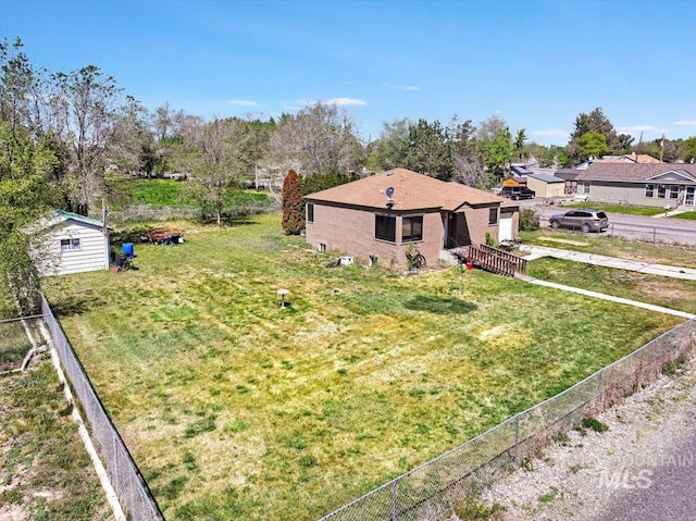 805 Utah, Gooding, ID 83330 - view of side of home featuring driveway, an outbuilding, and a garage