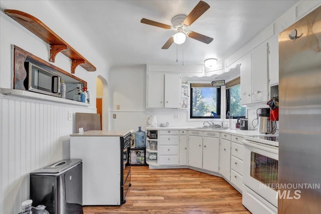 805 Utah, Gooding, ID 83330 - kitchen featuring white range with electric stovetop, freestanding refrigerator, a ceiling fan, light countertops, and white cabinets