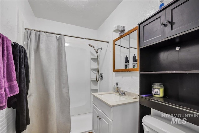 805 Utah, Gooding, ID 83330 - bathroom featuring a shower with shower curtain, vanity, and toilet