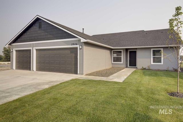 ranch-style house with a front yard and a garage