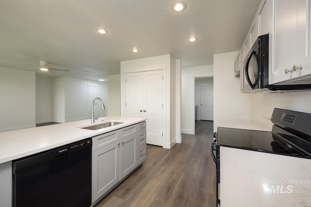 1410 Regency Way, Emmett, ID 83617 - kitchen featuring black appliances, a sink, recessed lighting, light countertops, and dark wood finished floors