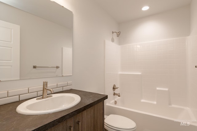 full bathroom with vanity, shower / bath combination, and toilet