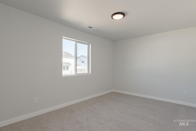 empty room featuring carpet floors