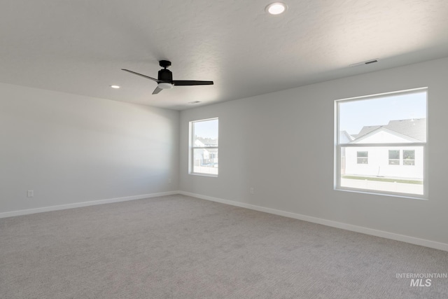 carpeted empty room with ceiling fan