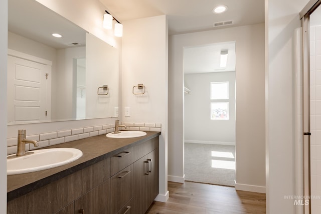 bathroom with vanity and hardwood / wood-style flooring