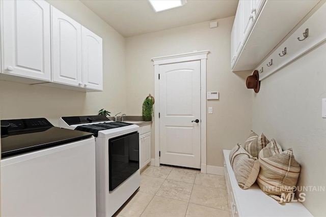 25374 W Deep Canyon Dr, Star, ID 83644 - laundry area featuring washing machine and dryer, cabinet space, and light tile patterned floors