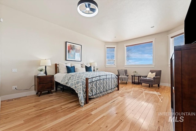 25374 W Deep Canyon Dr, Star, ID 83644 - bedroom with light wood-style floors and baseboards