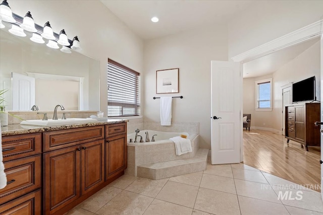 25374 W Deep Canyon Dr, Star, ID 83644 - full bath with vanity, a garden tub, and tile patterned floors