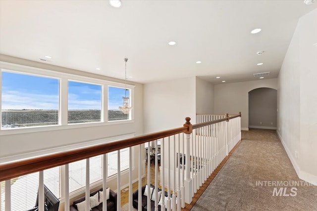 25374 W Deep Canyon Dr, Star, ID 83644 - hall featuring arched walkways, light carpet, baseboards, and recessed lighting