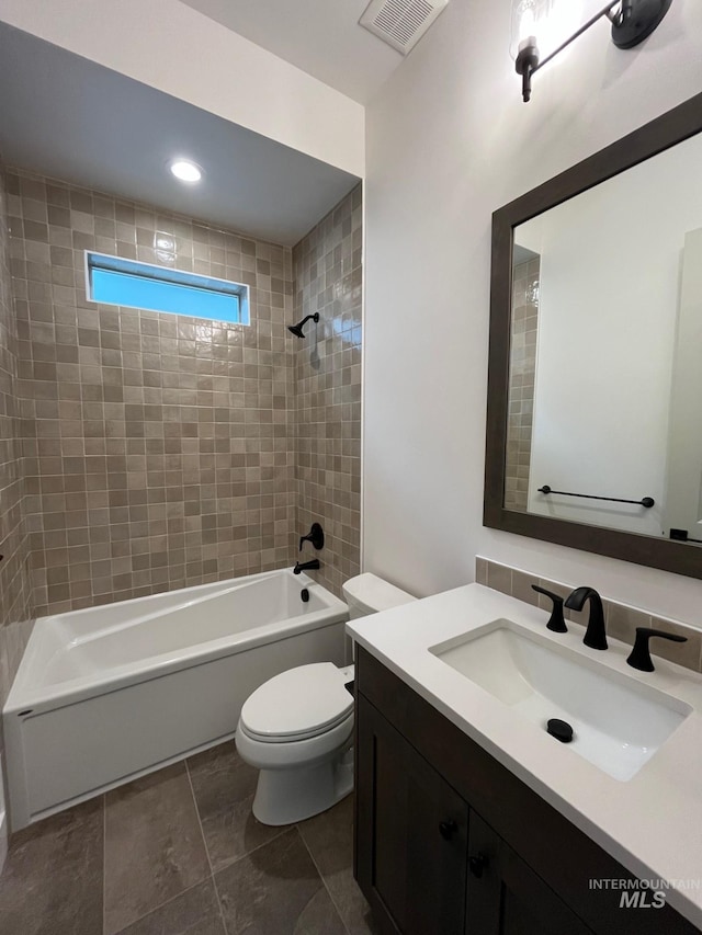 full bath featuring visible vents, tub / shower combination, toilet, and vanity