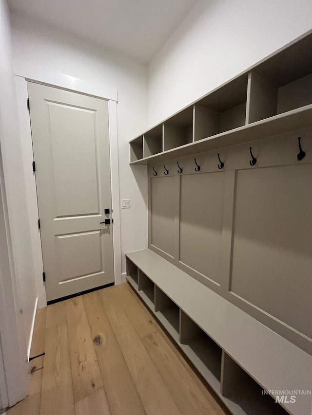 mudroom with light wood-style floors