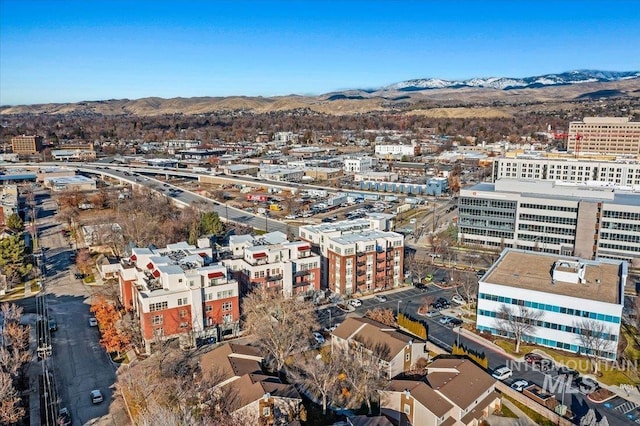 birds eye view of property with a mountain view