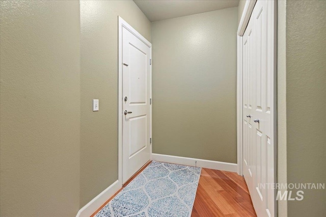 doorway with light hardwood / wood-style floors