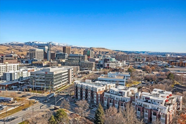 property's view of city featuring a mountain view