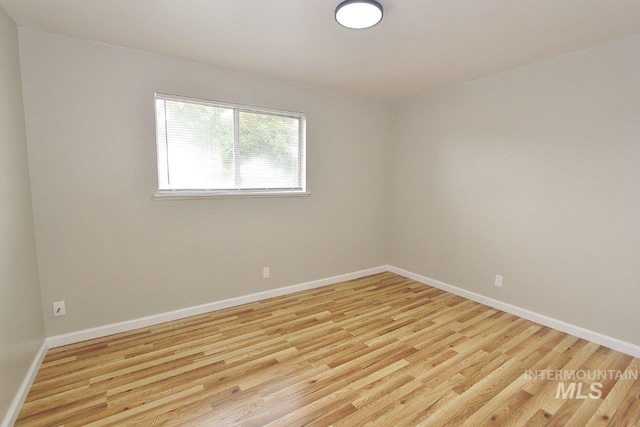 spare room featuring light hardwood / wood-style flooring