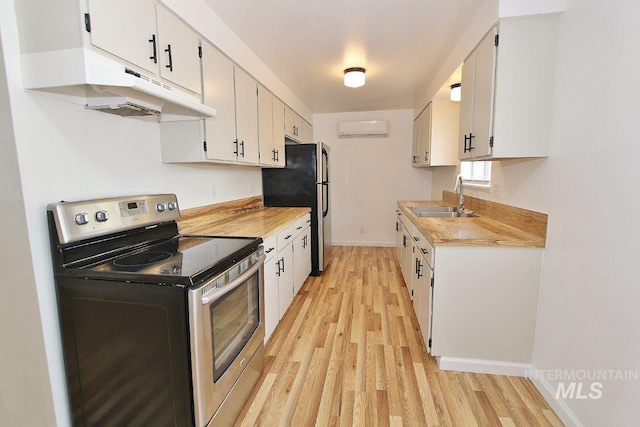 kitchen with stainless steel appliances, sink, and white cabinets