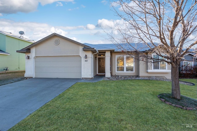 ranch-style home with a front yard and a garage