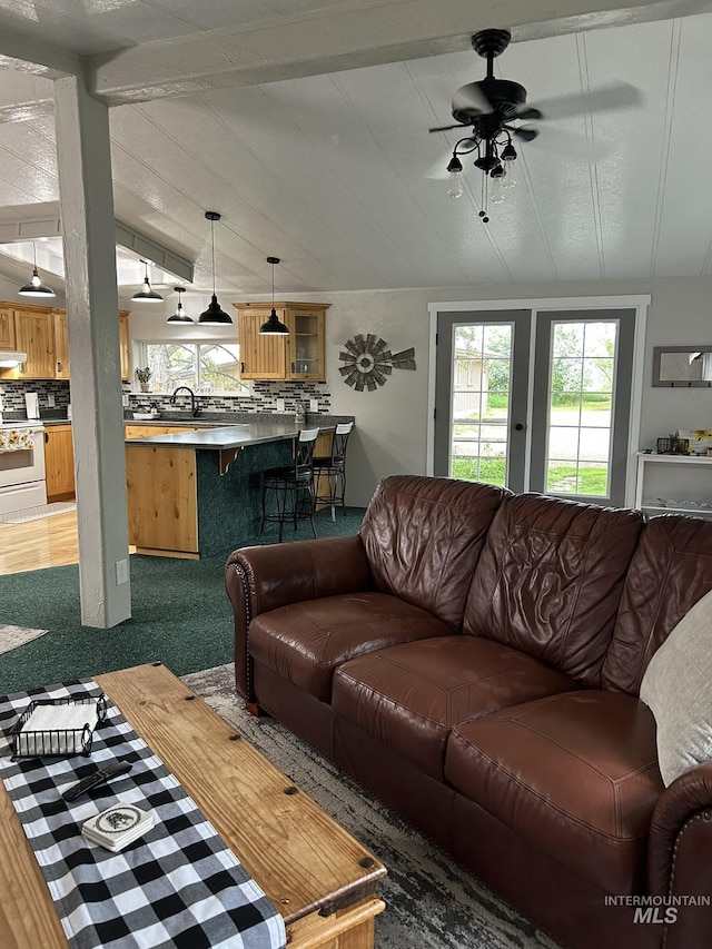 1614 E 1800 S, Gooding, ID 83330 - carpeted living room featuring a ceiling fan and lofted ceiling