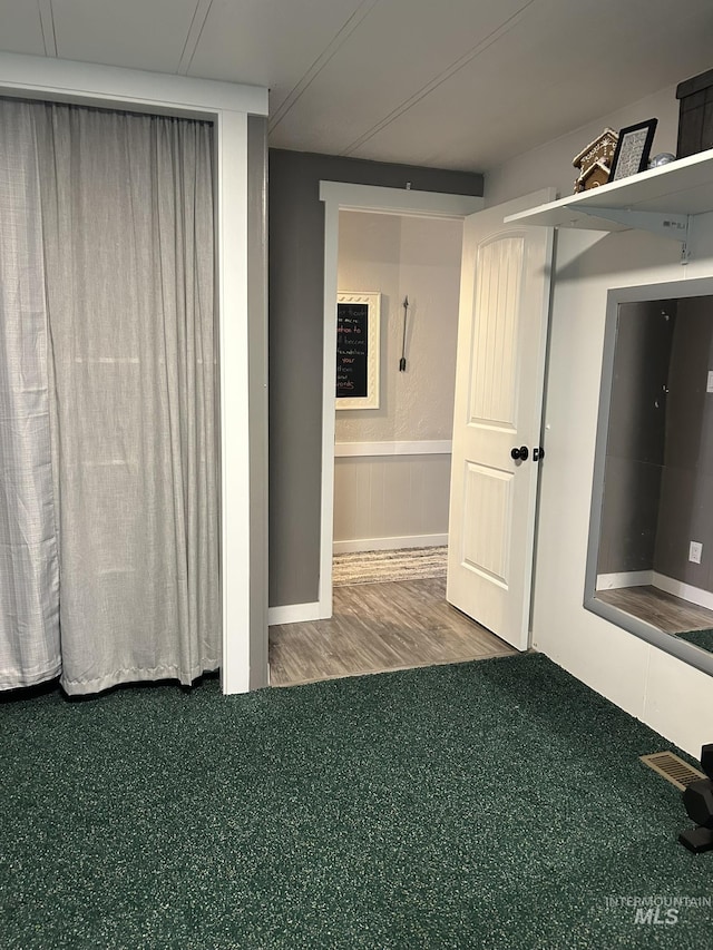1614 E 1800 S, Gooding, ID 83330 - unfurnished room featuring carpet floors and wood finished floors