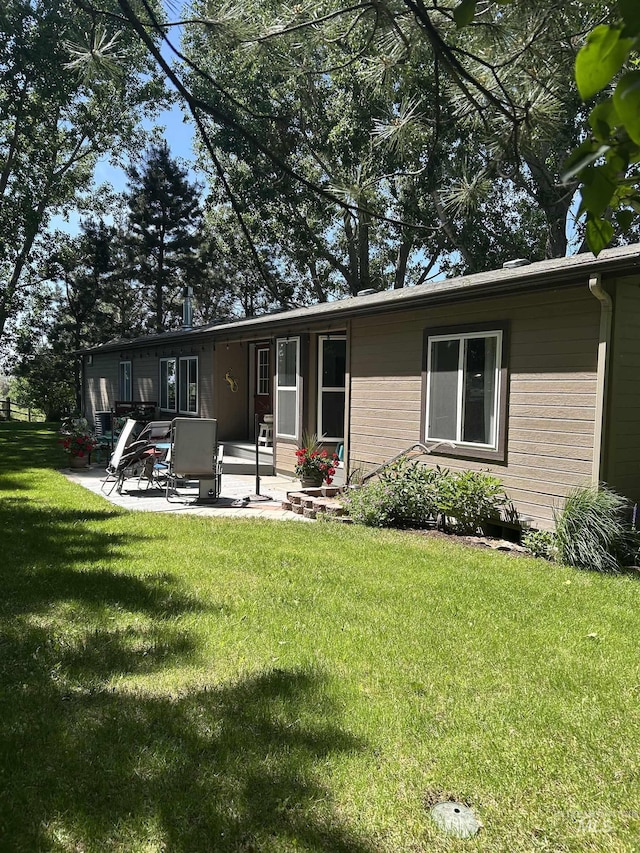 1614 E 1800 S, Gooding, ID 83330 - back of property featuring a patio and a lawn