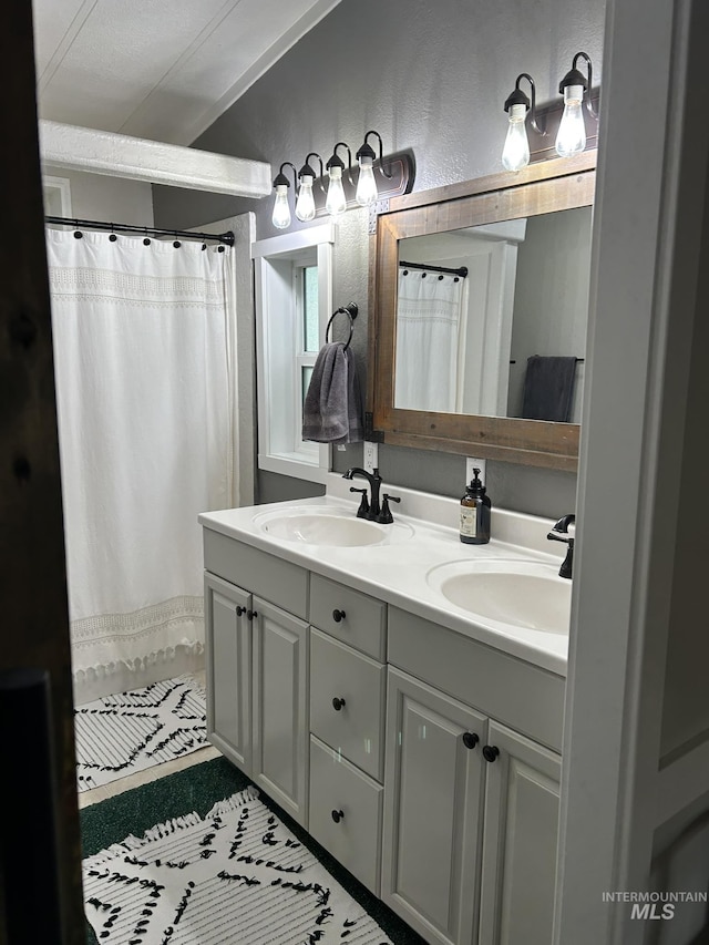 1614 E 1800 S, Gooding, ID 83330 - bathroom with double vanity, tile patterned floors, and a shower with curtain