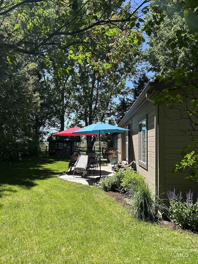 1614 E 1800 S, Gooding, ID 83330 - view of grassy yard featuring a patio