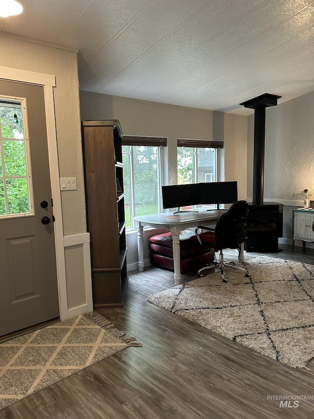 1614 E 1800 S, Gooding, ID 83330 - foyer entrance with a wood stove, wood finished floors, a textured wall, and a textured ceiling