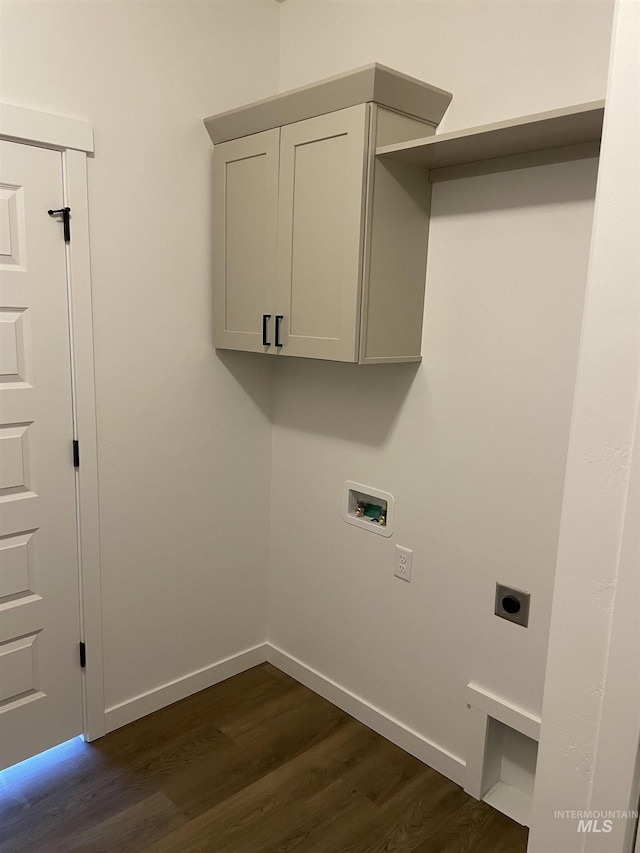 clothes washing area with dark wood-type flooring, hookup for a washing machine, electric dryer hookup, and baseboards