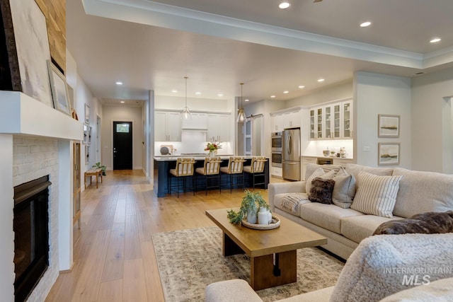 4014 W Farm View Dr, Boise, ID 83714 - living area with light wood-type flooring, recessed lighting, and a fireplace