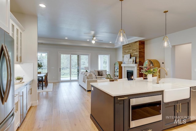 4014 W Farm View Dr, Boise, ID 83714 - kitchen featuring a sink, appliances with stainless steel finishes, ceiling fan, light countertops, and white cabinets