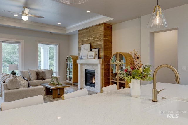 4014 W Farm View Dr, Boise, ID 83714 - living area with a fireplace, a raised ceiling, ceiling fan, and recessed lighting