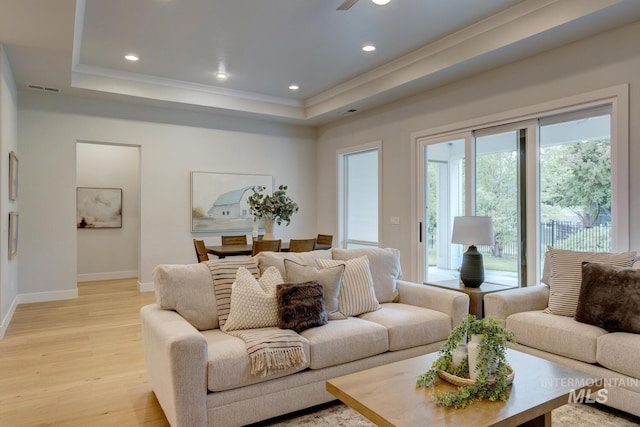 4014 W Farm View Dr, Boise, ID 83714 - living room featuring a tray ceiling, light wood-style flooring, crown molding, baseboards, and recessed lighting