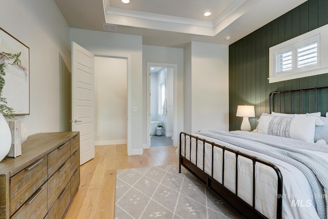 4014 W Farm View Dr, Boise, ID 83714 - bedroom featuring light wood finished floors, baseboards, recessed lighting, a tray ceiling, and ensuite bathroom