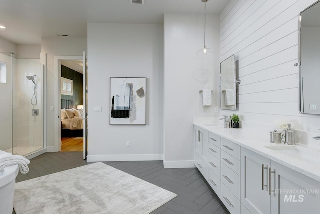 4014 W Farm View Dr, Boise, ID 83714 - ensuite bathroom with double vanity, a stall shower, and tile patterned floors