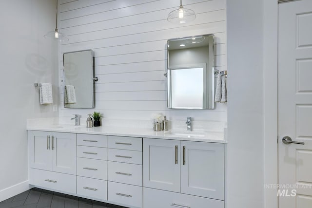 4014 W Farm View Dr, Boise, ID 83714 - full bathroom featuring double vanity, baseboards, wooden walls, and tile patterned flooring