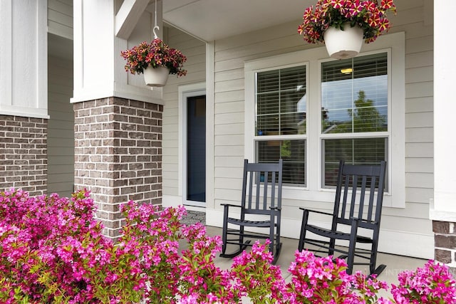 4014 W Farm View Dr, Boise, ID 83714 - doorway to property featuring covered porch and brick siding