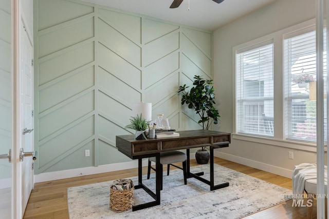 4014 W Farm View Dr, Boise, ID 83714 - office with healthy amount of natural light, a ceiling fan, light wood finished floors, baseboards, and a decorative wall