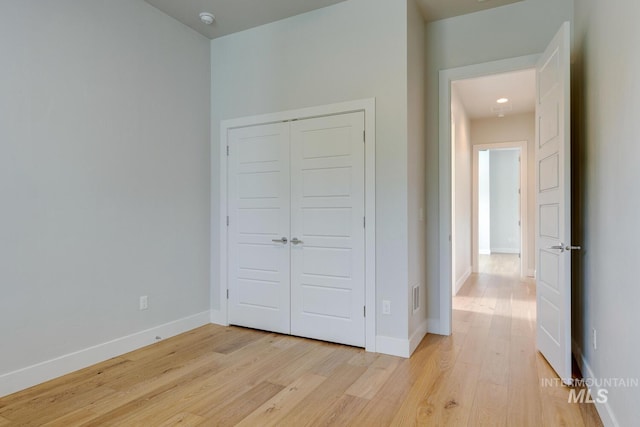 4014 W Farm View Dr, Boise, ID 83714 - unfurnished bedroom with light wood finished floors, baseboards, and a closet