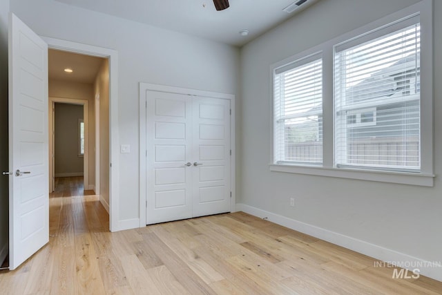 4014 W Farm View Dr, Boise, ID 83714 - unfurnished bedroom with baseboards, light wood finished floors, and a closet