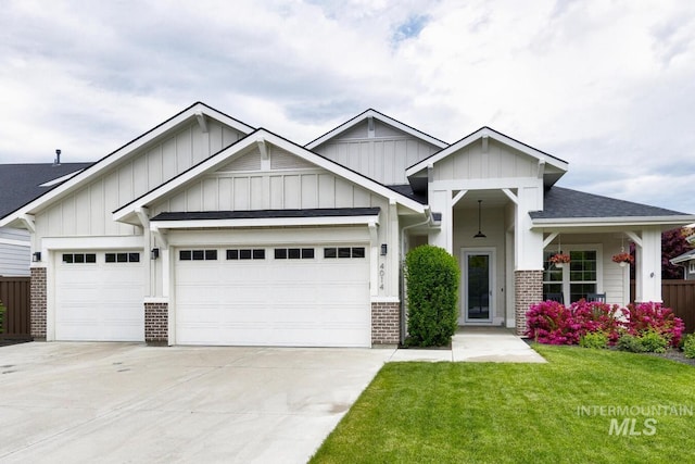 4014 W Farm View Dr, Boise, ID 83714 - craftsman-style home with board and batten siding, brick siding, an attached garage, and driveway